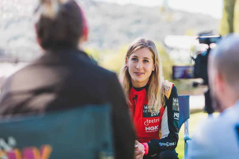 Facialteam patient Charlie Martin at the racetracks being interviewed for her facial feminization surgery testimonial