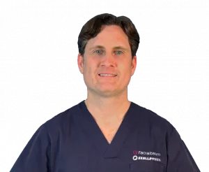 Profile picture of Dr. Ildefonso Labrot in surgical outfit, Facial Feminization Surgeon at Facialteam.