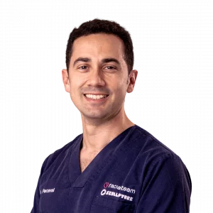 Profile picture of Dr. Miguel Perceval in surgical outfit, Facial Feminization Surgeon at Facialteam.
