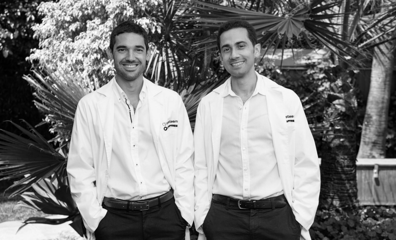 Facialteam Facial Feminization Scientists Dr. Fermín Capitán and Dr. Miguel Perceval of Facialteam's R&D department in black and white