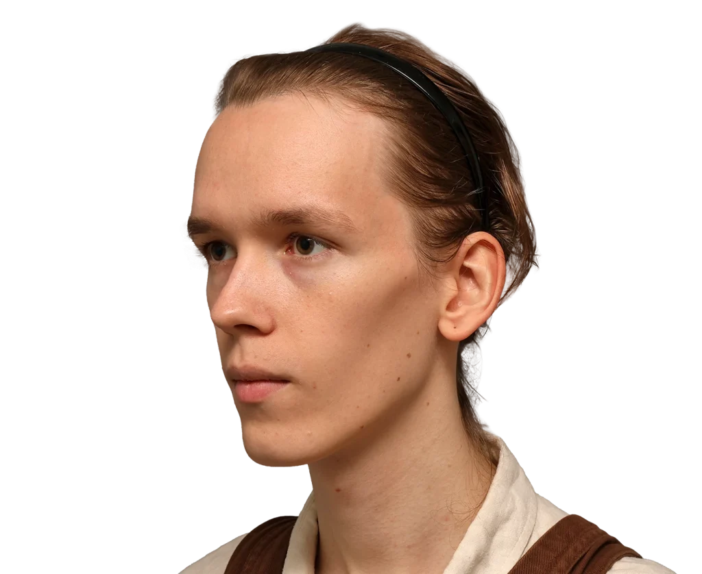 Profile of a young Zoey facing left with a black headband, light skin, and neutral expression.
